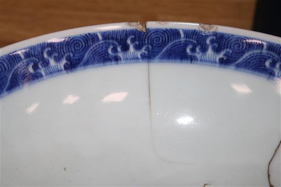 A Chinese Kraak blue and white dish, an Iznik style jar and a Chinese blue and white bowl, bearing a Qianlong mark diameter 36cm